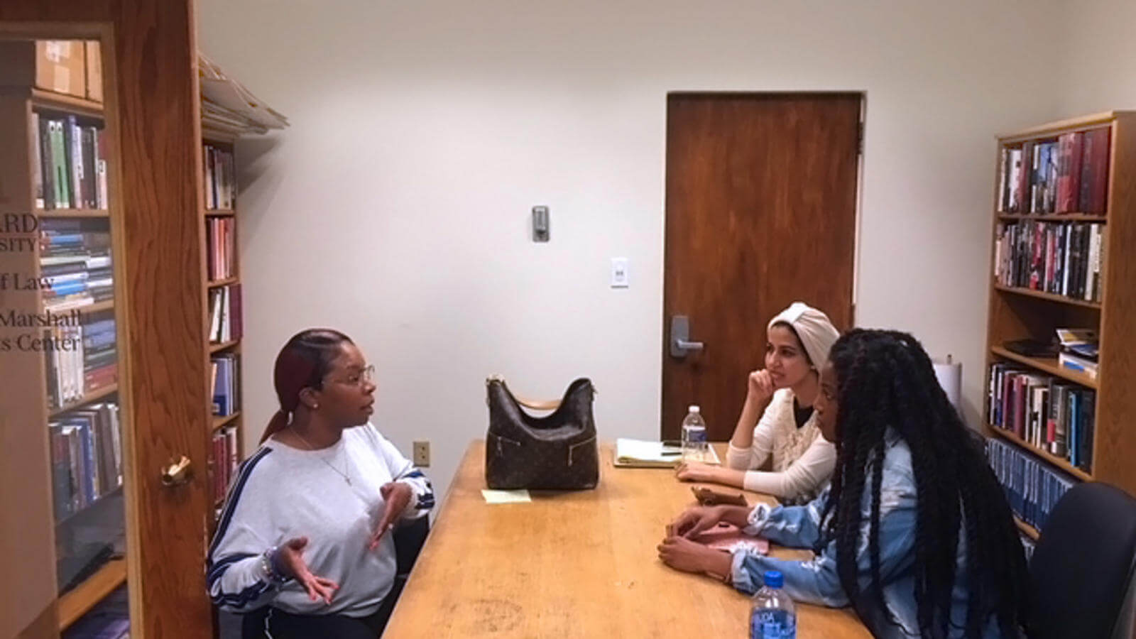 Mike Brown's mother (left) talks with Howard students.